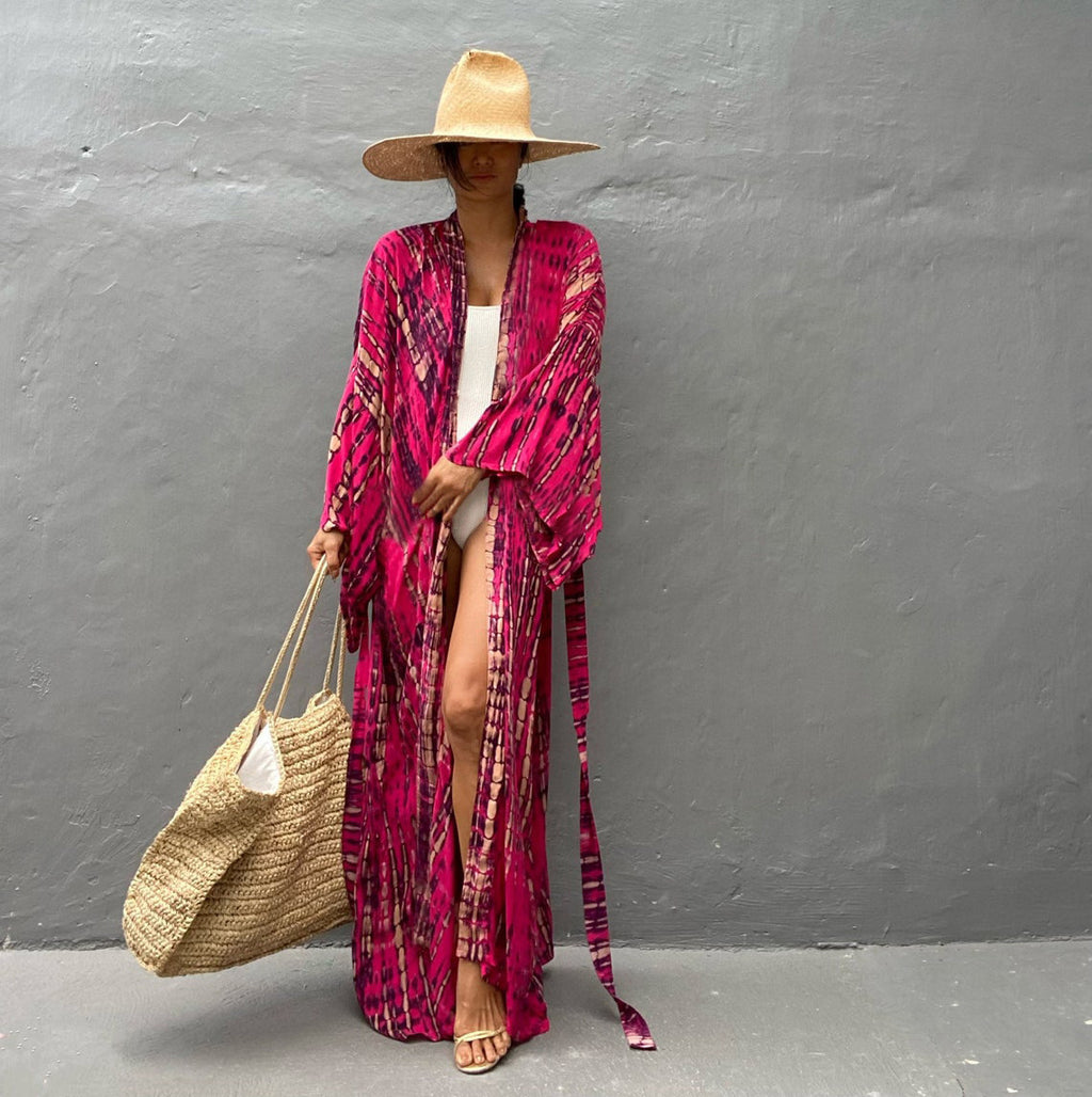 Trenches of Mariana rayon tie-dye beach cover-up with sun protection, loose fit, perfect for women's vacation swimwear.