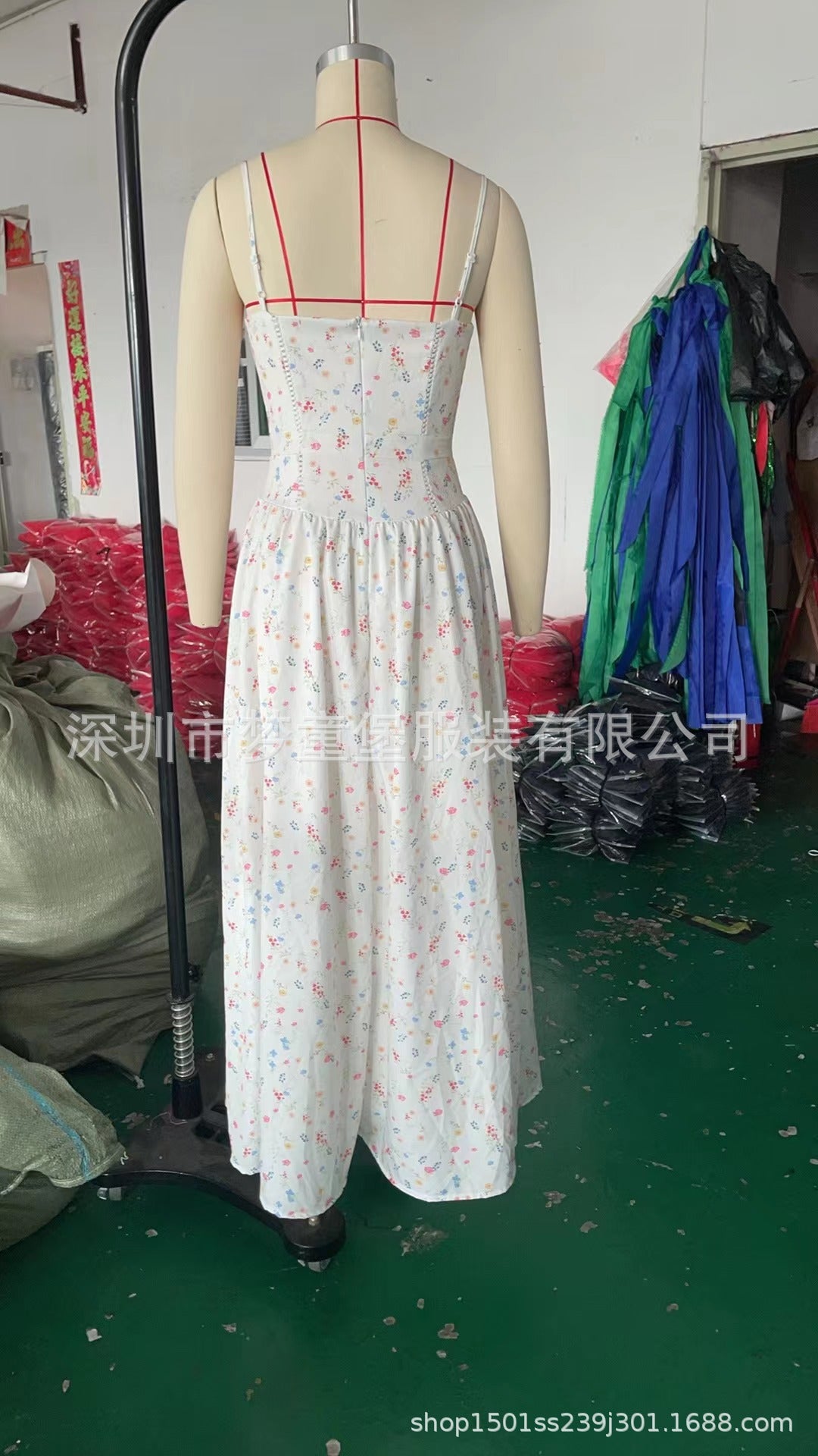 Trenches of Mariana long sleeveless spring dress with spaghetti straps, printed flared skirt, low neckline, and waist-cinching design.