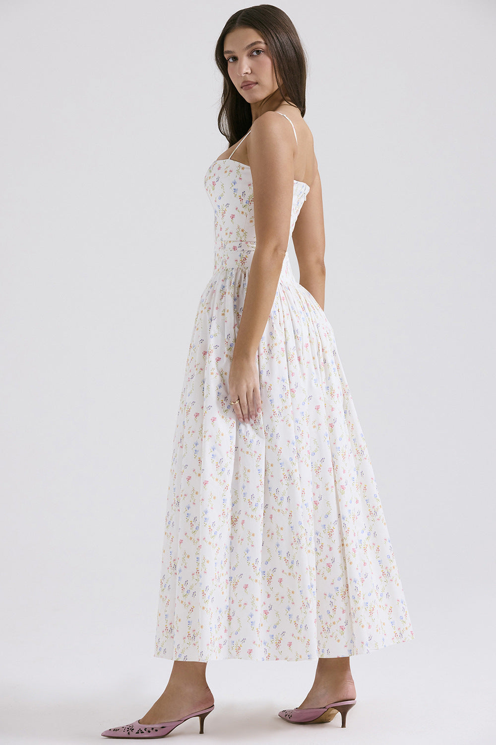 Long sleeveless printed skirt from Trenches of Mariana featuring spaghetti straps, low-neck, waist cinching, and flared design.