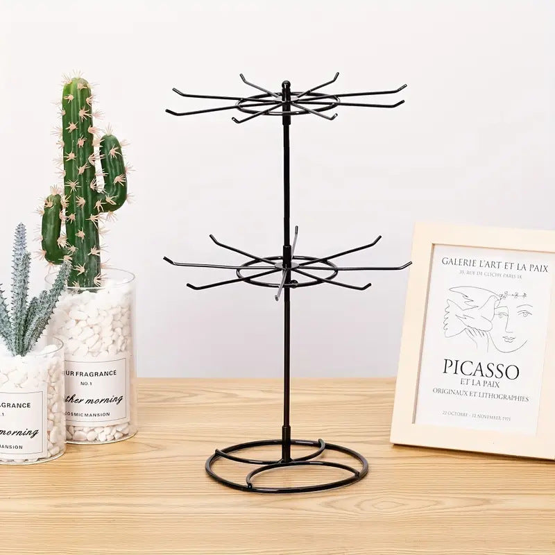 Trenches of Mariana rotating jewelry display rack with two-layer shelf for necklaces and bracelets, showcasing organized jewelry storage.