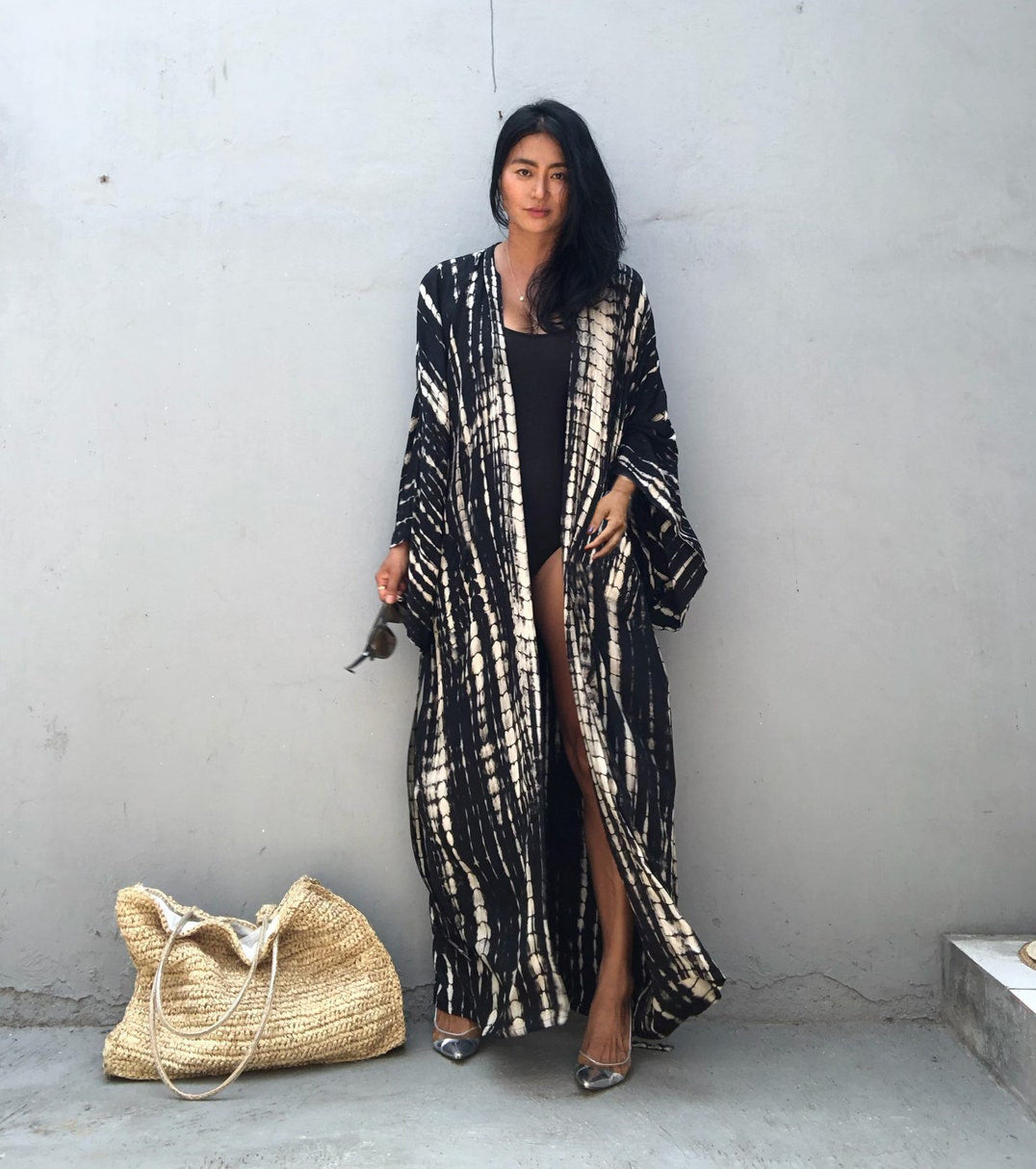 Women's loose rayon tie-dye beach cover-up with sun protection, featuring a relaxed fit and vibrant pattern by Trenches of Mariana.