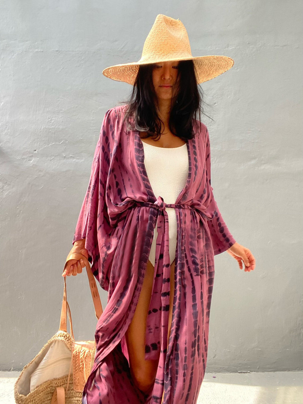 Women's loose rayon tie-dye beach cover-up by Trenches of Mariana, stylish sun protection for vacation swimsuits.