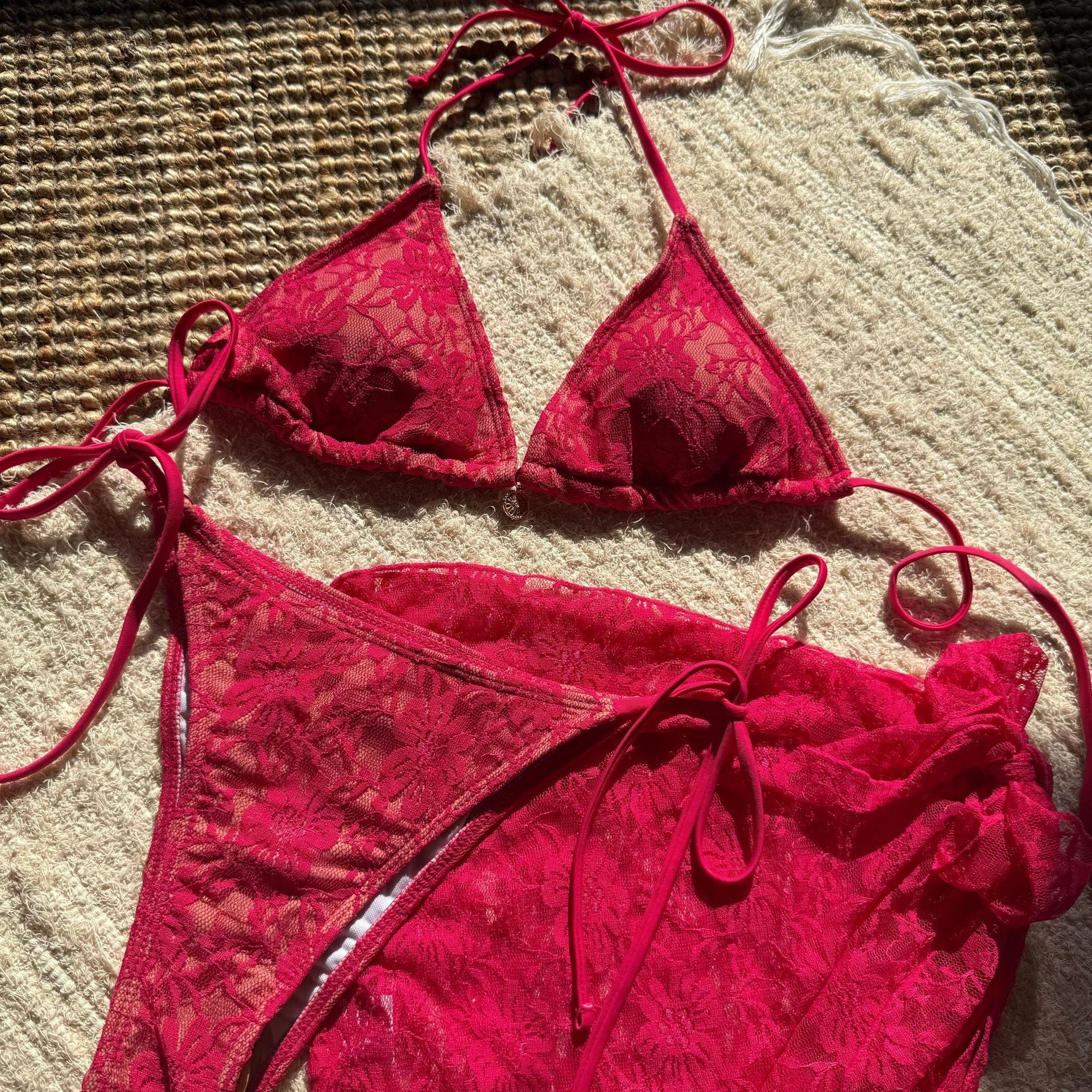 European and American lace mesh bikini by Trenches of Mariana featuring a three-piece short skirt swimsuit with sexy, sheer fabric.