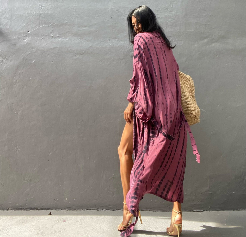 Colorful rayon tie-dye beach cover-up by Trenches of Mariana featuring a loose, sun-protective design for women's swimwear.