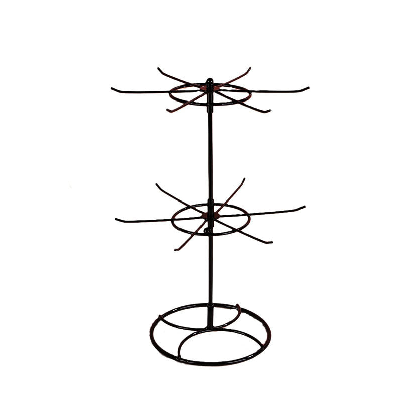 Rotating jewelry display rack with two-layer shelf for necklaces and bracelets by Trenches of Mariana.