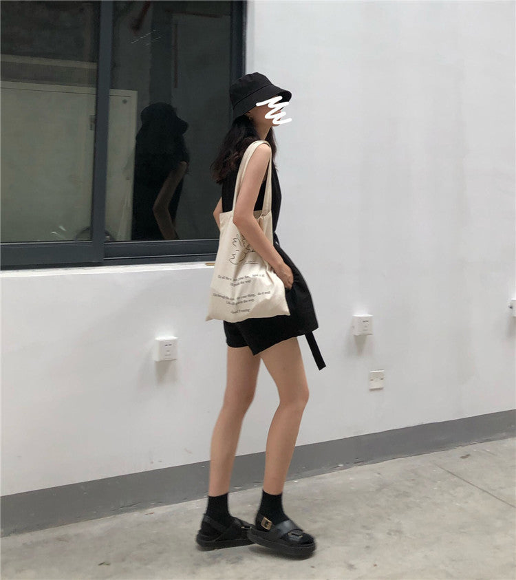 Casual female streetwear jumpsuit by Trenches of Mariana featuring a loose, two-piece Hong Kong style sportswear look.