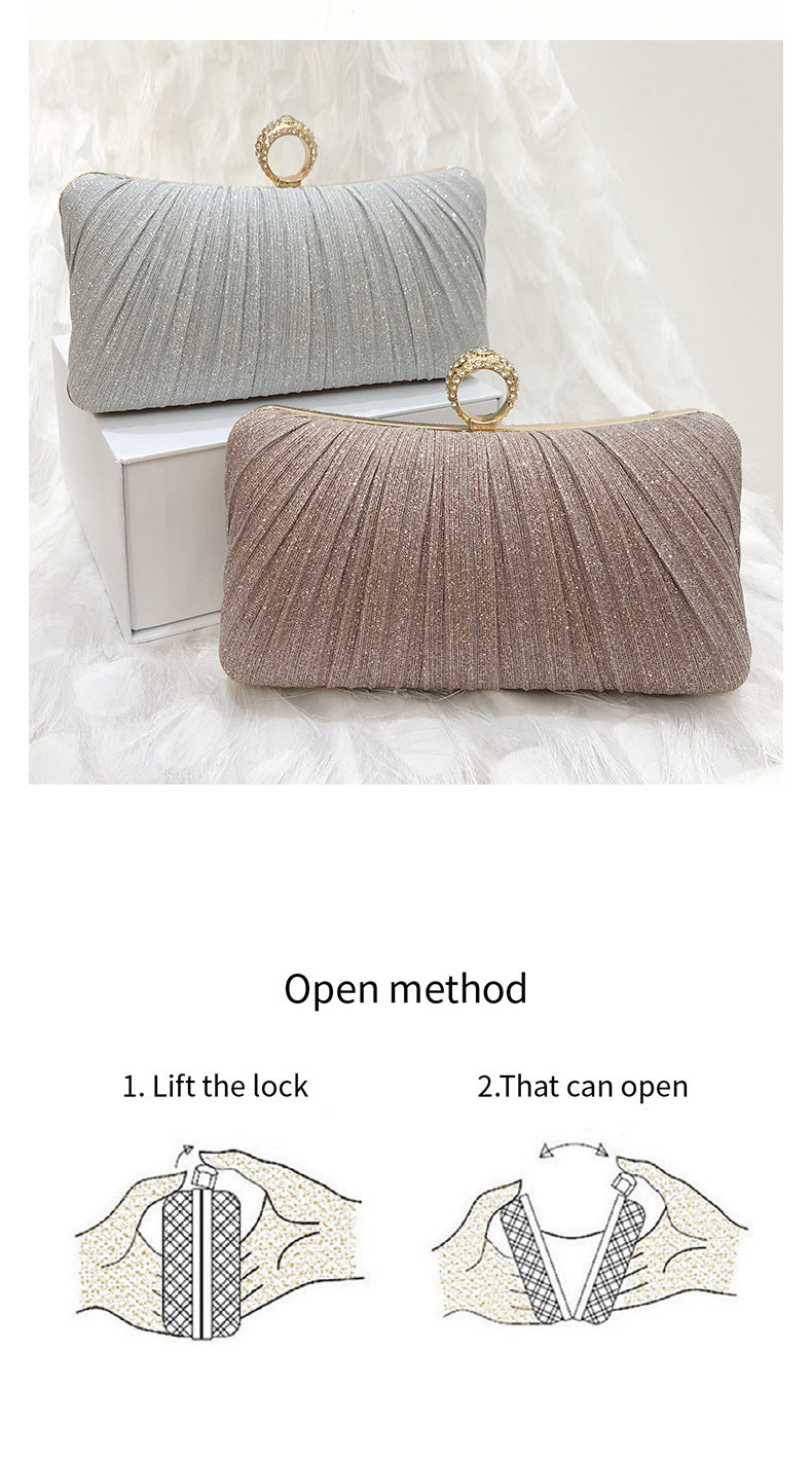 Trenches of Mariana pleated Chinese-style dinner clutch bag with cross-body strap, suitable for evening and banquet occasions.