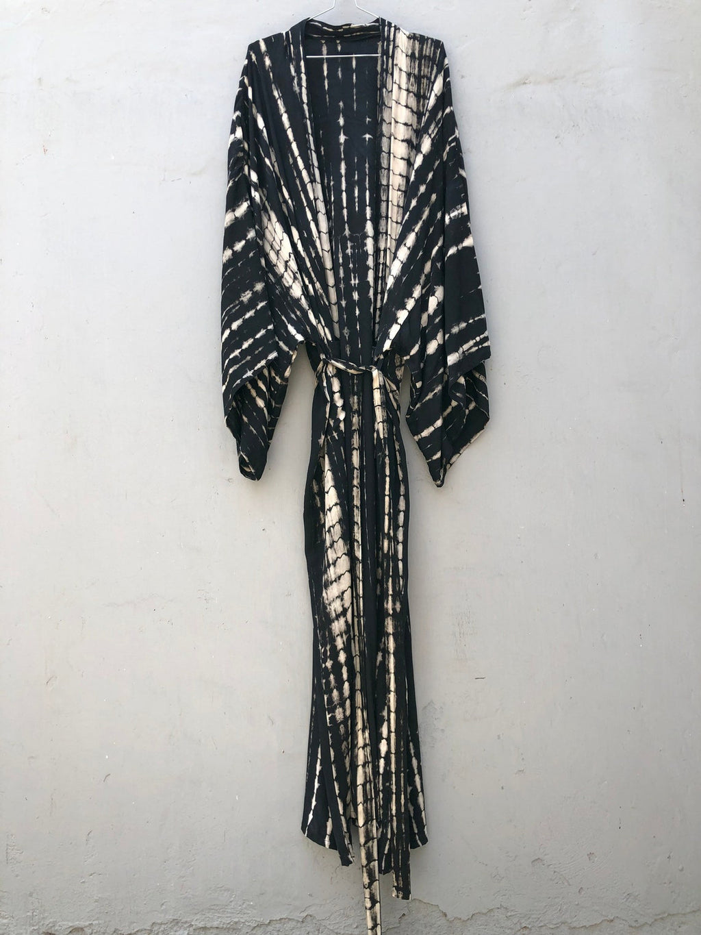 Trenches of Mariana rayon tie-dye beach cover-up with sun protection, loose fit, ideal for women's vacation swimwear.