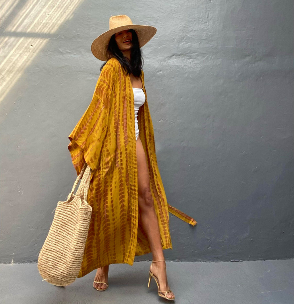Trenches of Mariana rayon tie-dye beach cover-up with sun protection, loose fit, perfect for women's vacation and swimwear.