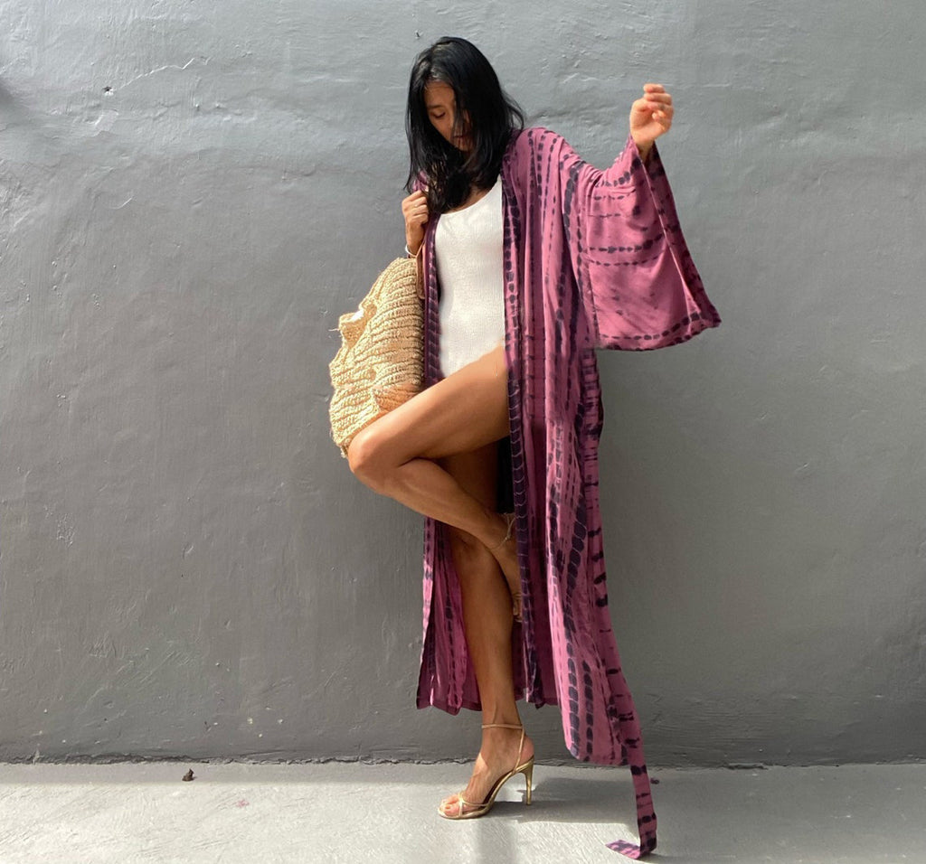 Trenches of Mariana rayon tie-dye beach cover-up with sun protection, loose fit, perfect for women's vacation over swimsuits.