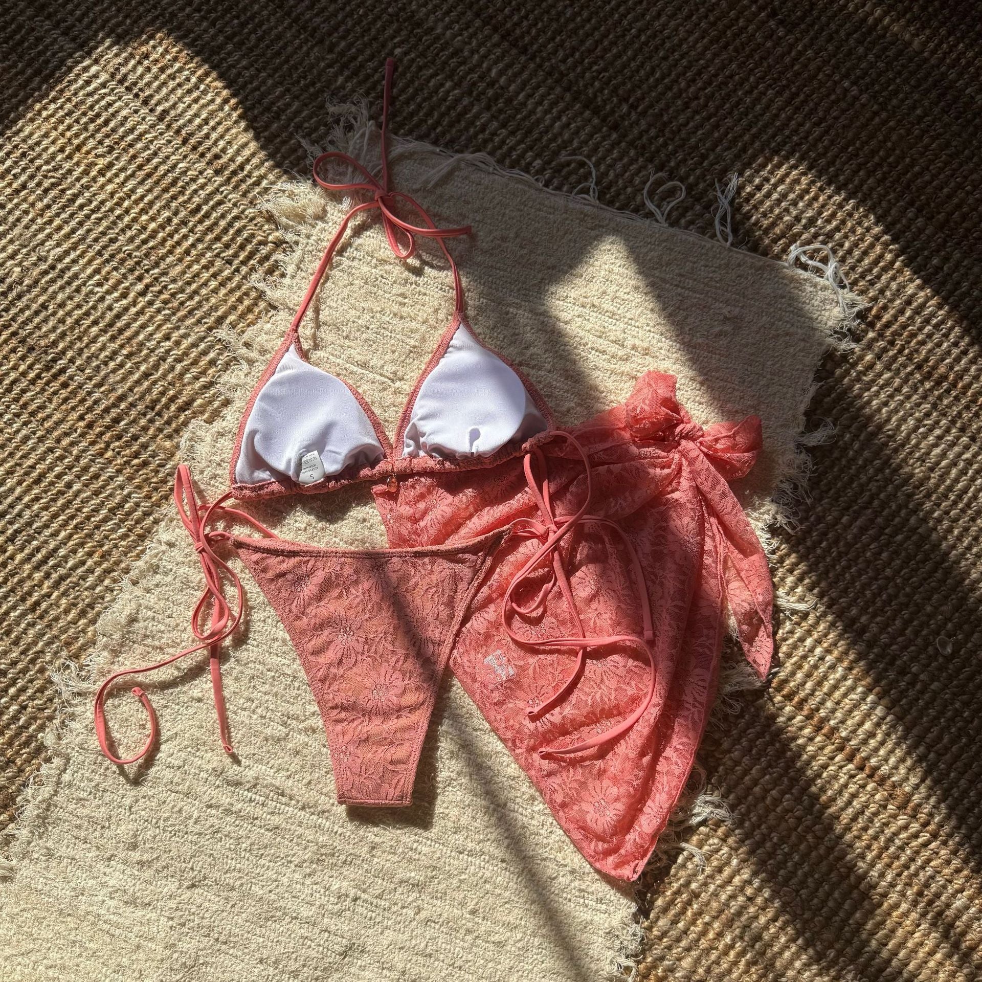 Trenches of Mariana European and American style three-piece lace mesh bikini swimsuit with short skirt, featuring sexy composite fabric design.