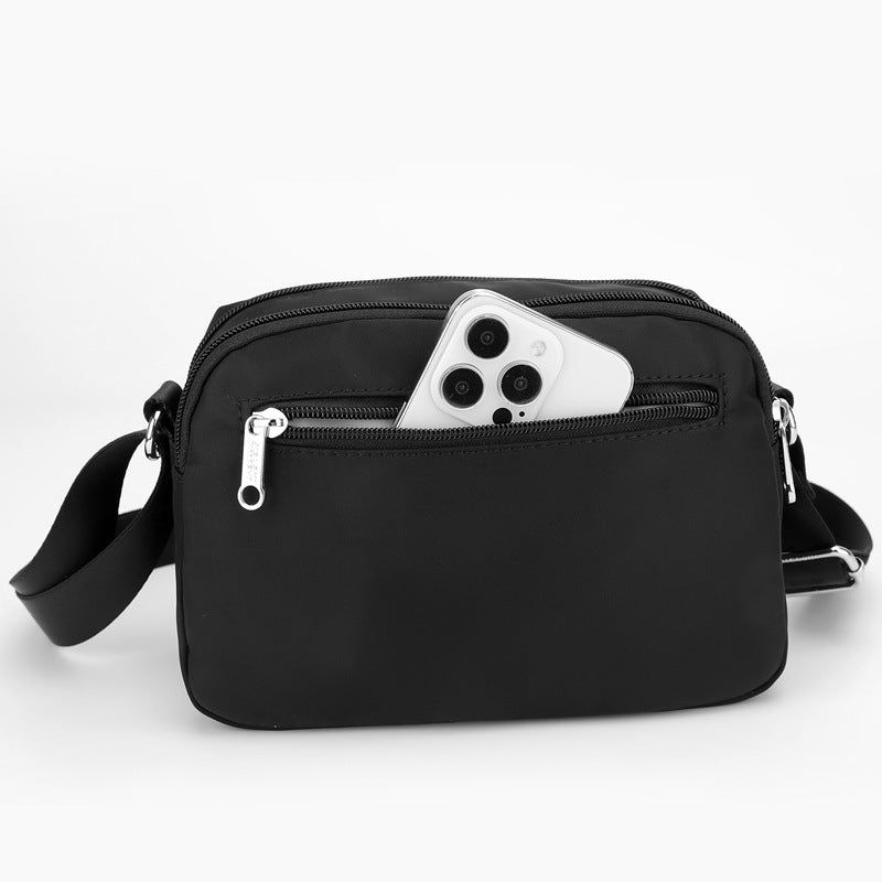 Fashionable women's crossbody bag by Trenches of Mariana made of lightweight water-repellent nylon with a casual, all-match style.
