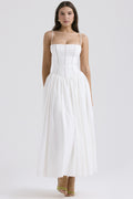 Trenches of Mariana women's sleeveless long dress with spaghetti straps, printed flared skirt, low neckline, and waist-cinching design.
