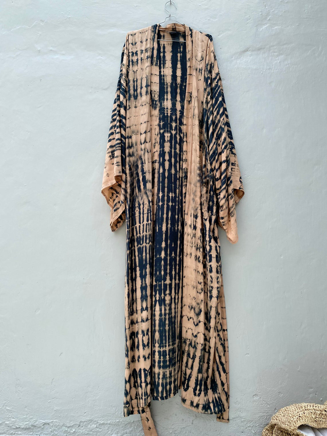 Trenches of Mariana rayon tie-dye beach cover-up for women, featuring sun protection and a loose fit over swimsuit at the beach.