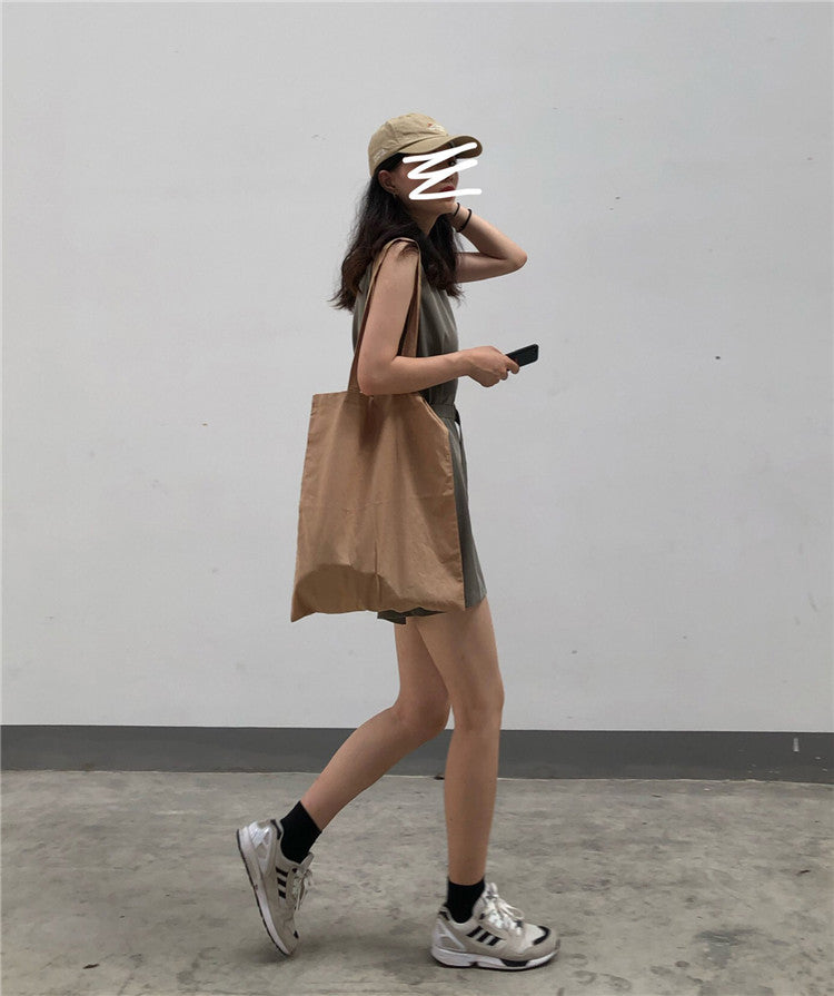 Casual female sportswear jumpsuit by Trenches of Mariana featuring a loose, two-piece Hong Kong style streetwear look.