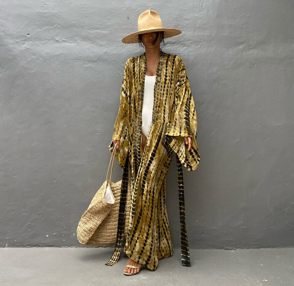 Trenches of Mariana rayon tie-dye beach cover-up with sun protection, loose fit, perfect for women's vacation and swimwear.