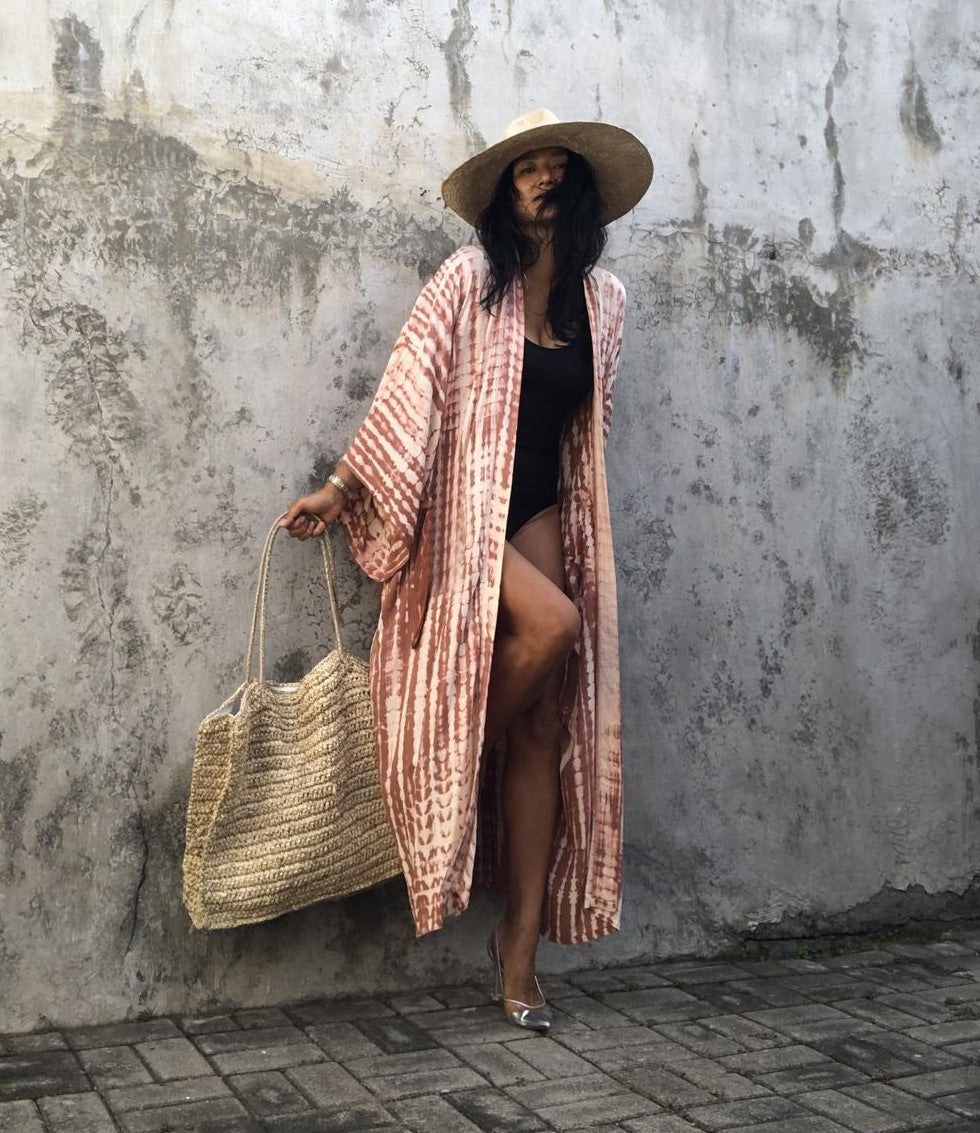 Women's loose beach cover-up by Trenches of Mariana featuring vibrant rayon tie-dye design, perfect for sun protection and vacation wear