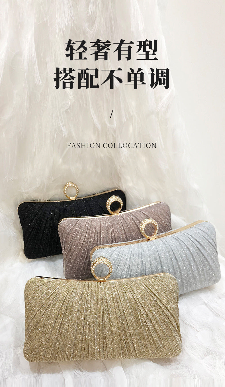Elegant pleated dinner bag by Trenches of Mariana featuring a Chinese-style design, perfect for evening and banquet occasions.