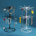 Rotating jewelry display rack with two-layer shelf for necklaces and bracelets, by Trenches of Mariana, showcasing organized jewelry.