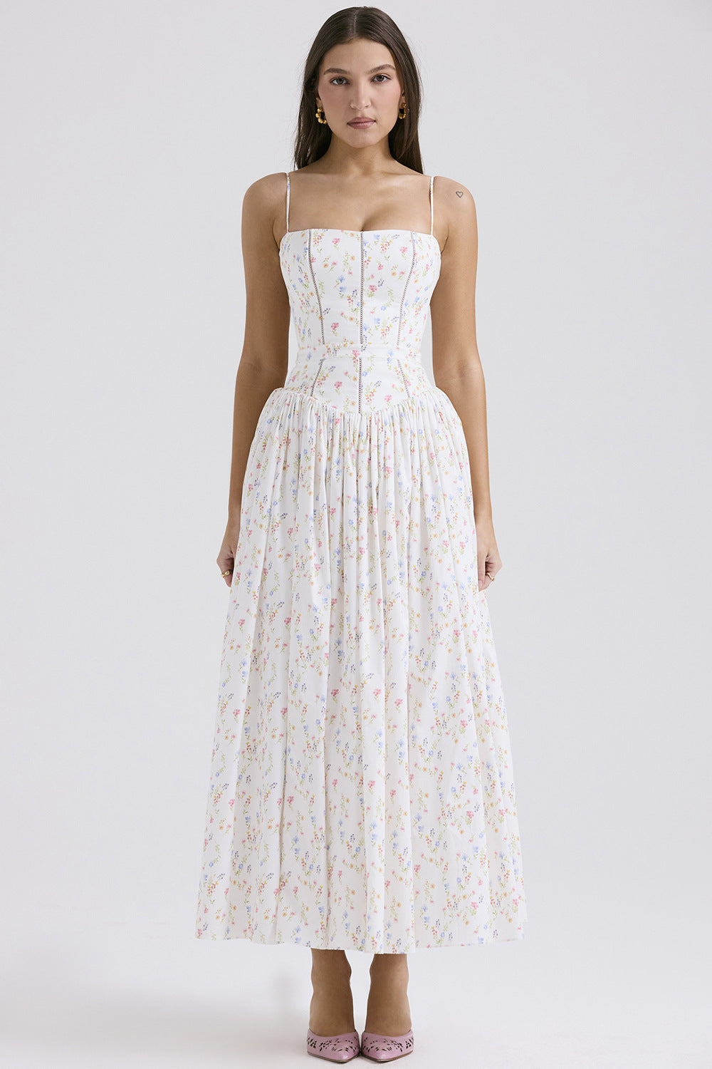 Trenches of Mariana long sleeveless printed flared skirt with spaghetti straps, low-neck design, and waist-cinching fit for spring fashion