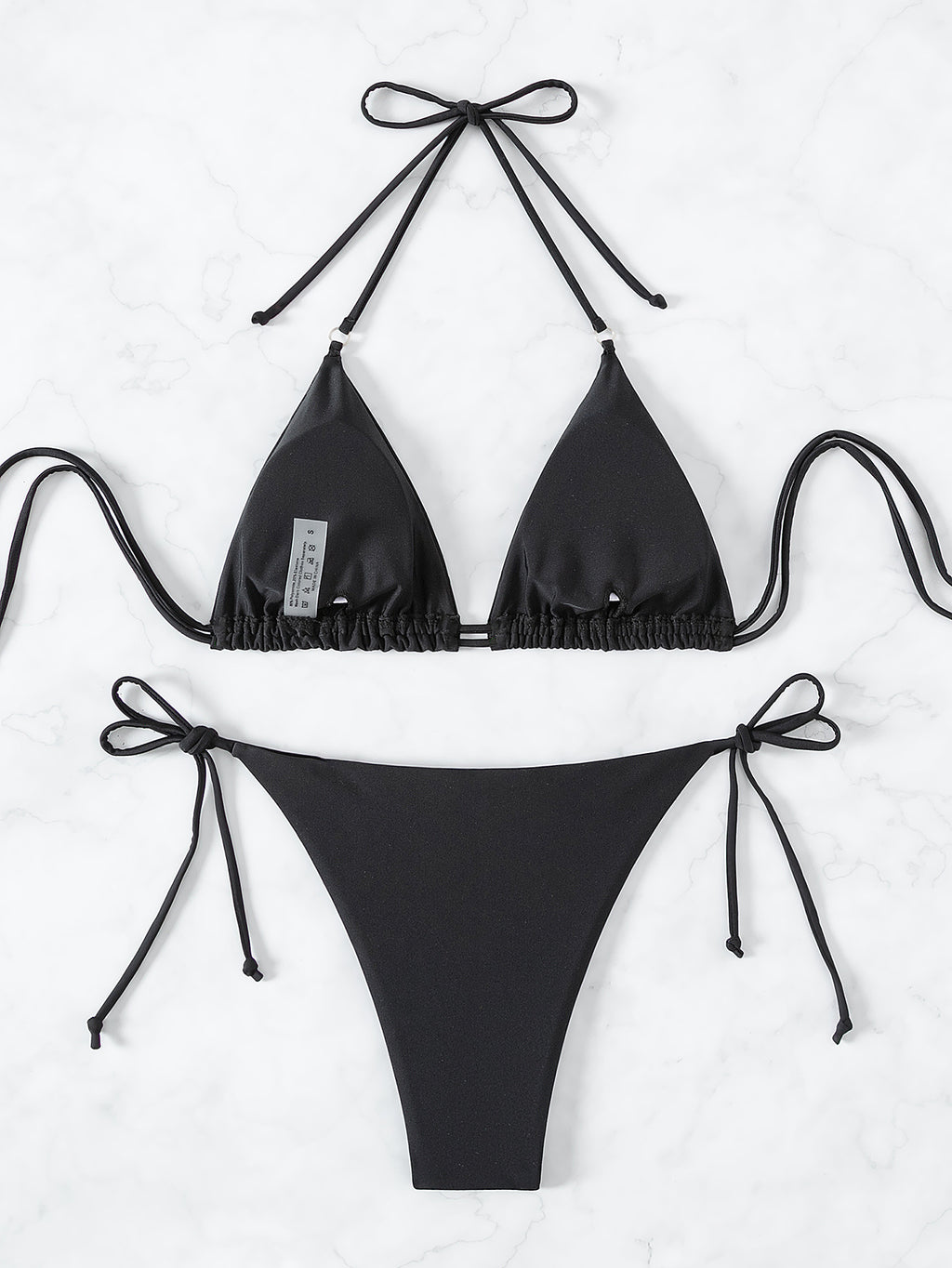 Trenches of Mariana sexy diamond bikini swimsuit with solid color, strappy design, perfect for beach or poolside wear.