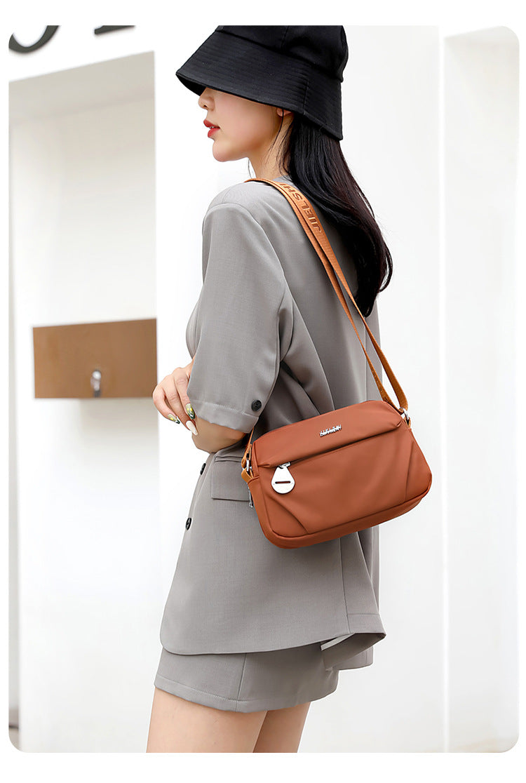 Trenches of Mariana lightweight water-repellent nylon crossbody bag for women, small casual shoulder bag, fashionable and versatile.