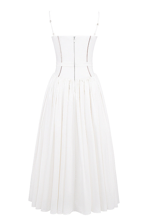 Long sleeveless printed flare skirt by Trenches of Mariana featuring spaghetti straps, low neck, and waist-cinching design.