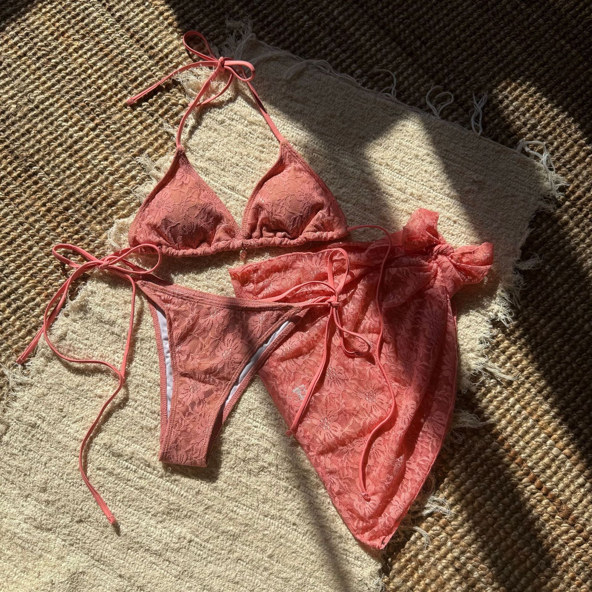 European and American lace mesh bikini swimsuit by Trenches of Mariana featuring a three-piece short skirt design.