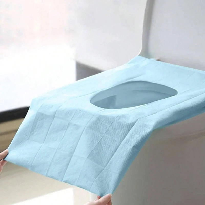 Disposable toilet seat covers by Trenches of Mariana, waterproof and portable paper mats for hotel, travel, or home bathroom use.