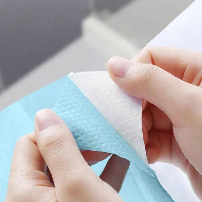Disposable toilet seat covers by Trenches of Mariana, waterproof and portable paper mats for hotel, travel, or home bathroom use.