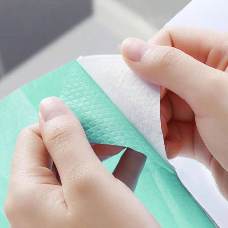 Disposable toilet seat covers by Trenches of Mariana, waterproof paper mats for travel, hotel, and bathroom use.