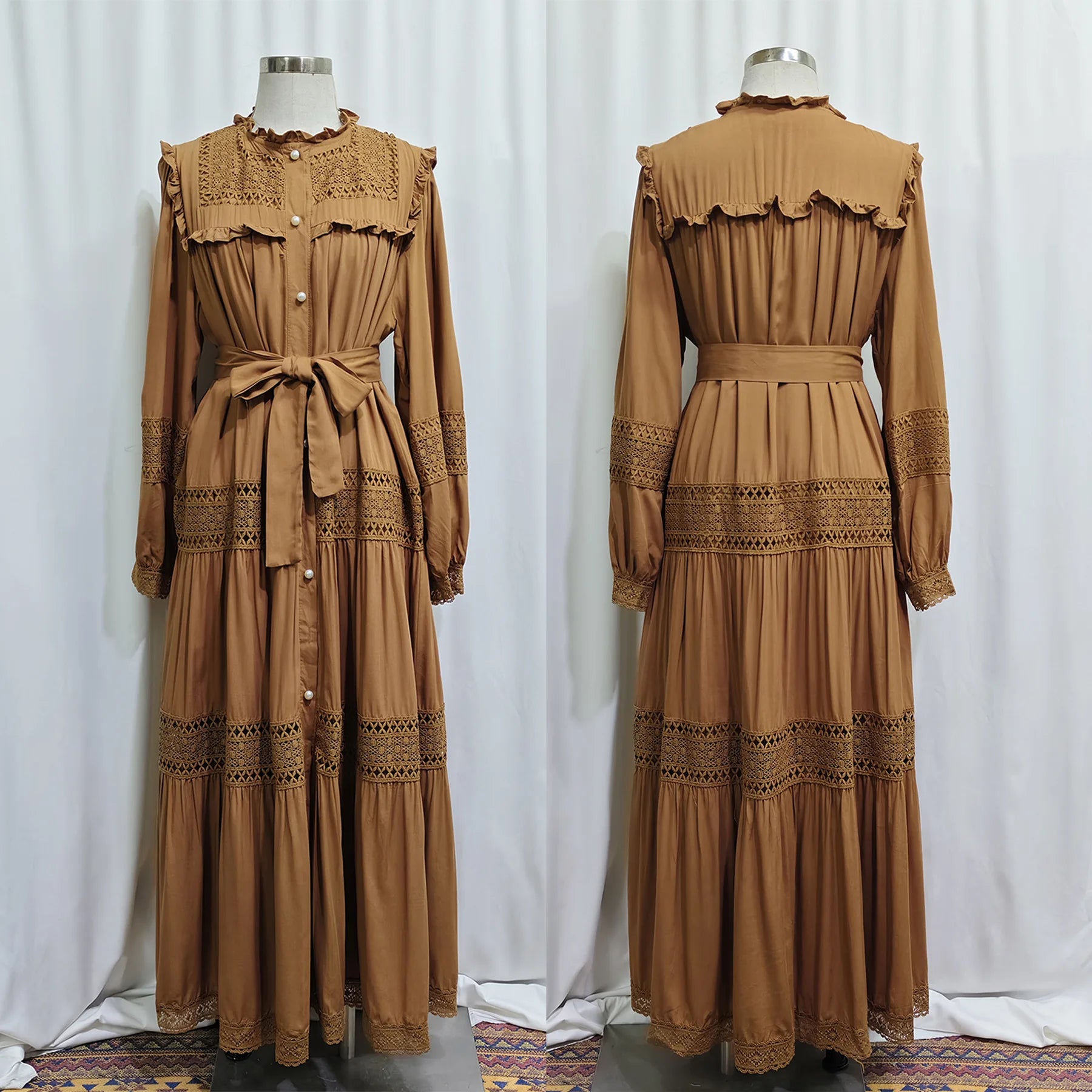 Elegant women’s lace dress by Trenches of Mariana featuring long, Islamic-inspired abaya with lace-up detail and intricate embroidery.