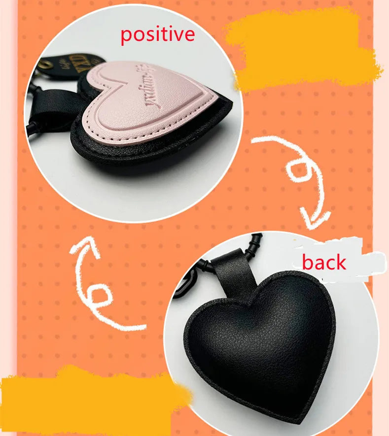 Pink heart-shaped leather car keychain with personalized face design, from Trenches of Mariana, for men and women.