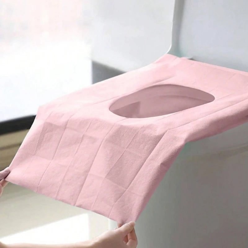 Disposable toilet seat covers from Trenches of Mariana, waterproof and portable paper mats for travel, hotel, and bathroom use.