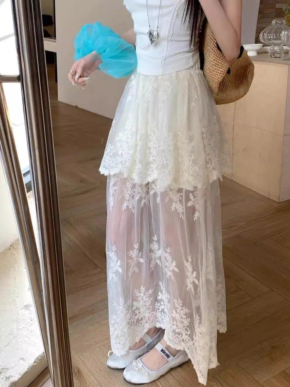 Elegant French retro lace skirt for women featuring mesh splicing, A-line style, perfect for summer 2026 by Trenches of Mariana.