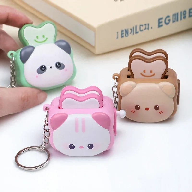 Cute Bread Machine Panda keychain by Trenches of Mariana with cartoon panda design, small stress-relieving accessory and creative gift.