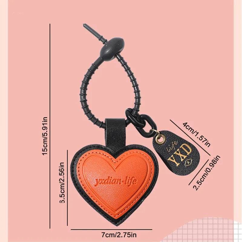 Pink heart-shaped leather car keychain with personalized engraving, designed by Trenches of Mariana for men's and women's bags.