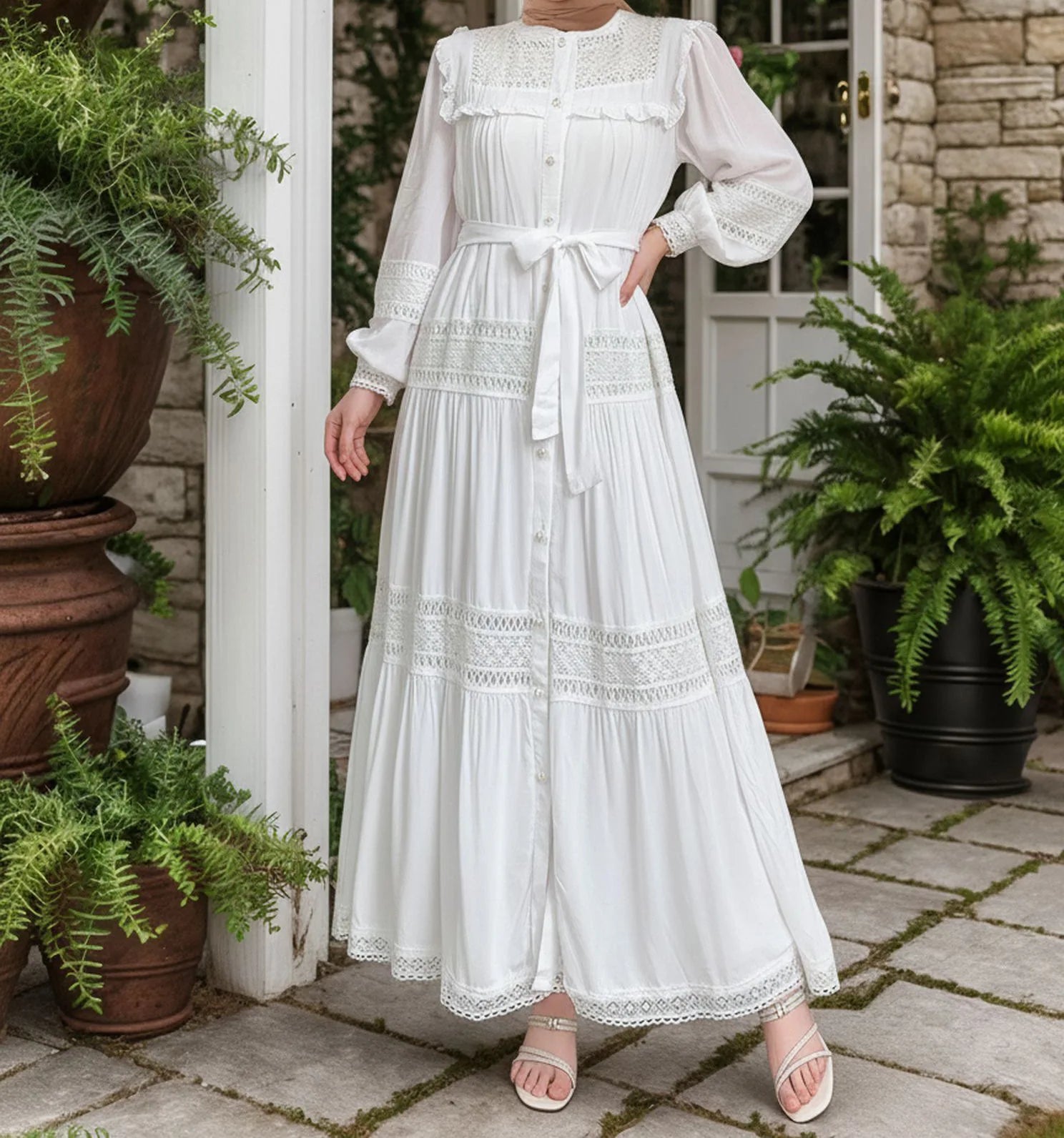 Women’s lace Eid dress by Trenches of Mariana featuring long Moroccan-inspired abaya style with lace-up front and elegant design.