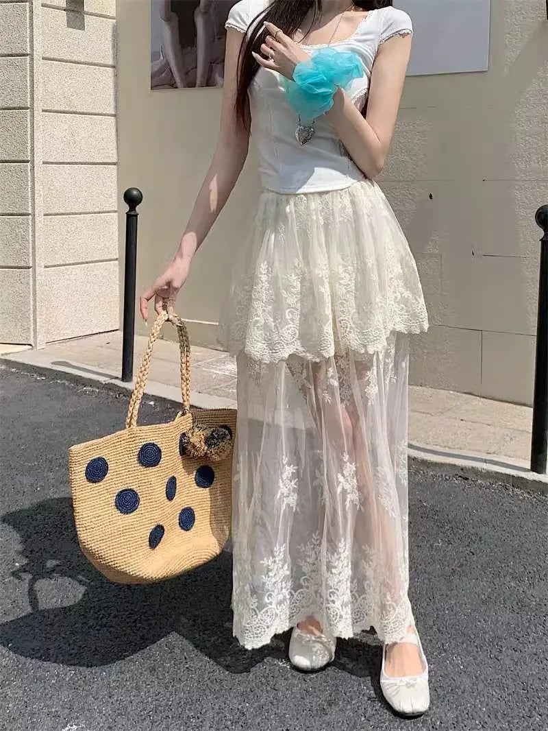 French retro lace A-line skirt for women featuring mesh splicing, summer 2026 elegant design by Trenches of Mariana.
