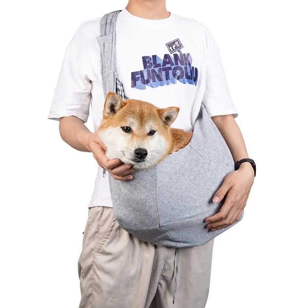 Trenches of Mariana puppy sling carrier bag with adjustable strap and soft fabric, designed for comfortable pet carrying.