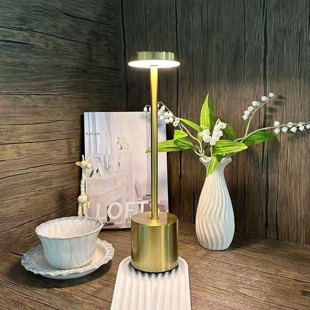 Trenches of Mariana touch control lamp with modern design, featuring a sleek base and illuminated touch-sensitive surface.